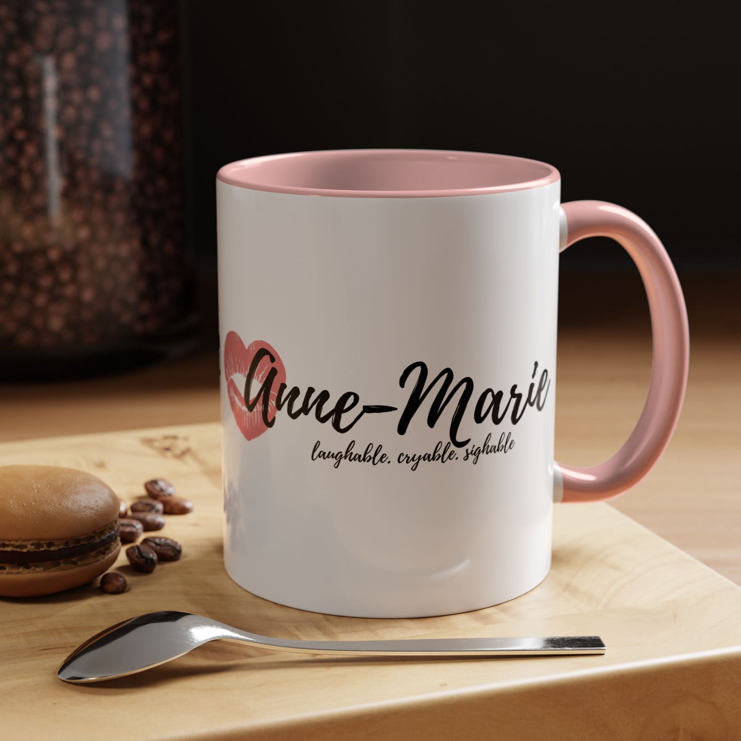 Anne-Marie 11 oz Coffee Cup on a table with a spoon